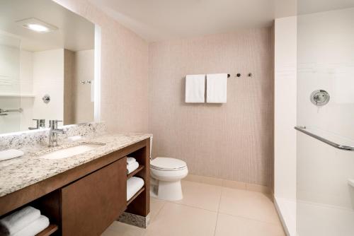 a bathroom with a toilet and a sink and a shower at Residence Inn Walnut Creek in Walnut Creek