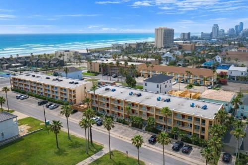 an aerial view of a hotel and the ocean at Fiesta Sol #110 home in South Padre Island