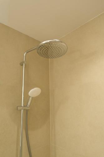 a shower with a shower head in a bathroom at Villa Selina 4 - Etheras Properties in Kythira