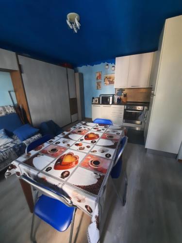 a kitchen with a table with a table cloth on it at casa RIVER in Scopello