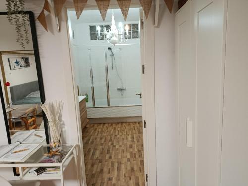 a bathroom with a shower and a mirror at Retales in Cartagena