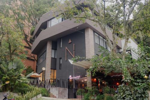 a building with a black roof at Nomadic Boutique Living and Experience Center in Medellín