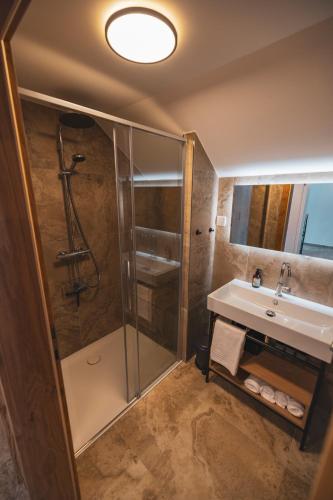 a bathroom with a shower and a sink at Der Sagbauer in Donnersbachwald