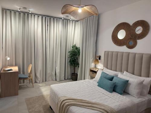 a bedroom with a bed and a mirror on the wall at Victoria's home near the beach with Swimming pool and elevator in Punta Cana