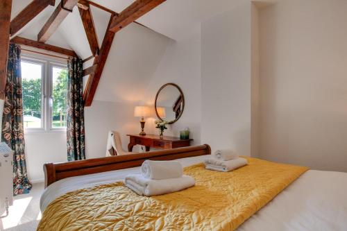 a bedroom with a bed with towels on it at 4 Bed in Broadstairs oc-w28331 in Broadstairs