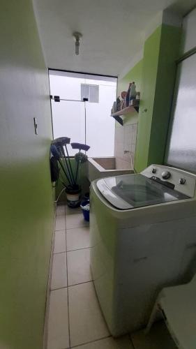 a bathroom with a toilet and a window at Kenatural in Cajamarca