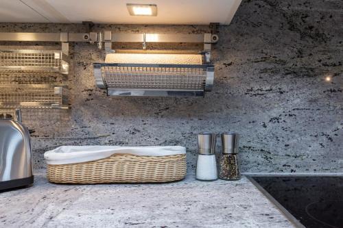 a kitchen with a sink and a counter top at Panoramic apartment with charming swiss interior in Wädenswil