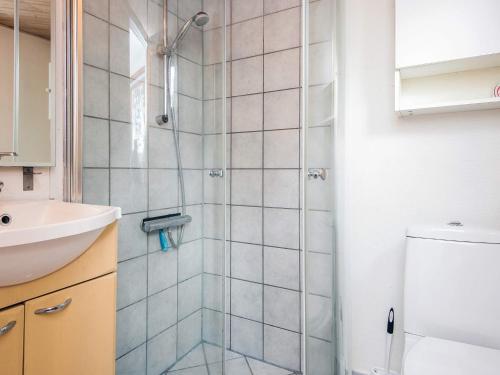 a bathroom with a shower and a sink at 4 person holiday home in Blåvand in Blåvand