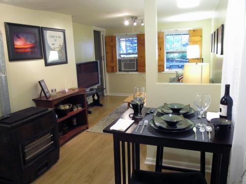 a living room with a table with wine glasses on it at Cozy Vintage Chicago Apartment near Downtown in Chicago