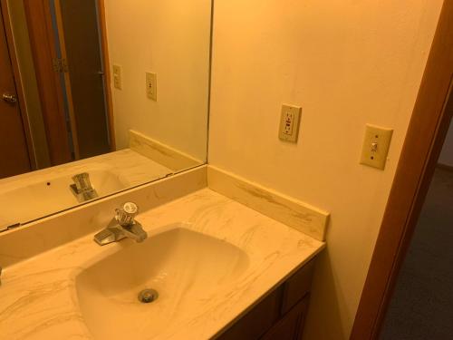 a bathroom with a sink and a mirror at The Upper Room in Milwaukee