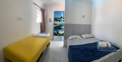 a room with two beds in a room at Pousada Camboinha in Cabedelo