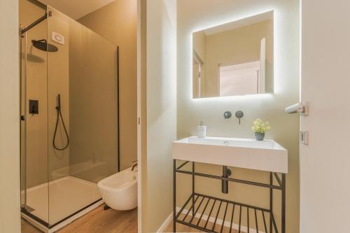 a bathroom with a sink and a shower at Dimora del Polpo - Centro Storico in Trapani