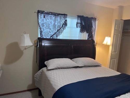 a bedroom with a large bed with a window at STR25-15 Home 3 Bedrooms 2 Bath in Marina