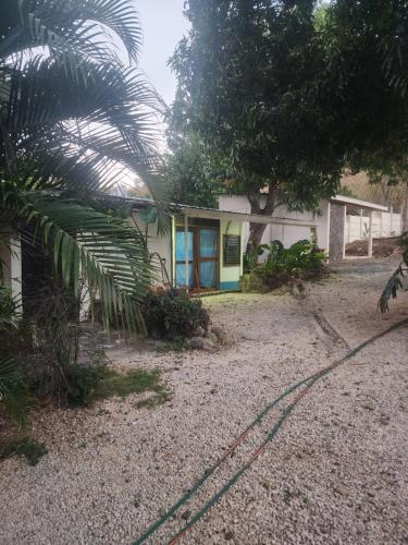 a house with a hose in front of it at tatay cabinas in La Cruz