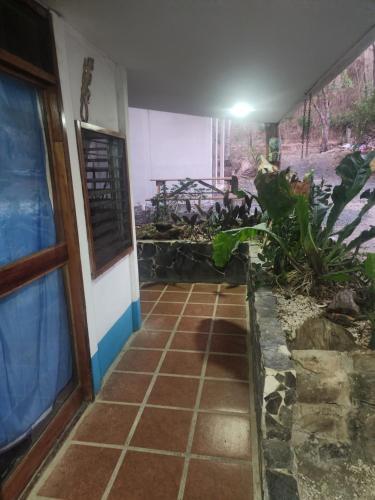 a room with a window and a tiled floor at tatay cabinas in La Cruz