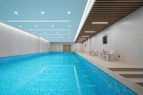 Baseinas apgyvendinimo įstaigoje 上海悦来度假酒店Shanghai Joy International Resort Hotel arba netoliese