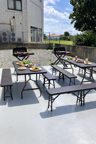 a group of picnic tables with food on them at 栞-shiori-FUNAKURA in Ishigaki Island