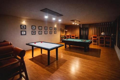 a room with two pool tables in a room at Hotel Express Quinta Soledad in Mexico City