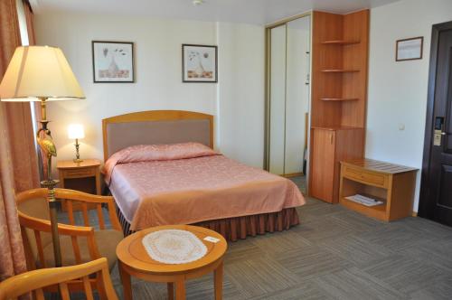 Vuode tai vuoteita majoituspaikassa Primorye Hotel