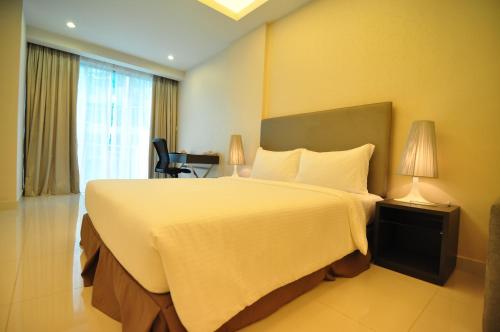 Katil atau katil-katil dalam bilik di Damas Suites & Residences Kuala Lumpur