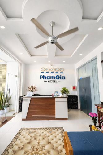 a hotel reception area with a ceiling fan at Pham Gia Hotel Mui Ne in Mui Ne
