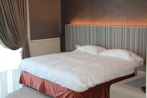 Setia Inn Suites Service Residenceにあるベッド