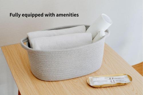 a basket sitting on top of a table with a thermometer at Shibuya Apartment Room Dogenzaka in Tokyo