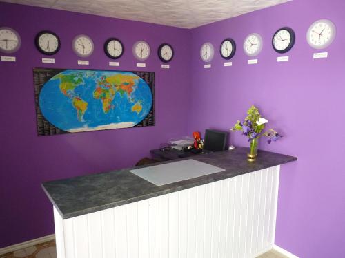an office with a counter with clocks on the wall at Hostal La Cabaña in Salou