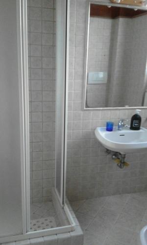 a bathroom with a shower and a sink at La casa di Nataly in Fregene