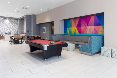 a room with a pool table and a tv at Tru By Hilton St Louis Downtown Mo in Saint Louis