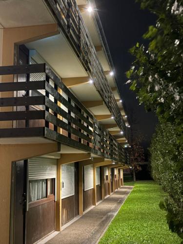 an external view of a building at night at Campanile Marmande in Marmande