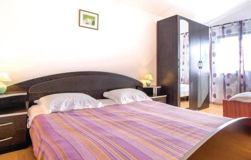 Posteľ alebo postele v izbe v ubytovaní Apartmani Lusi
