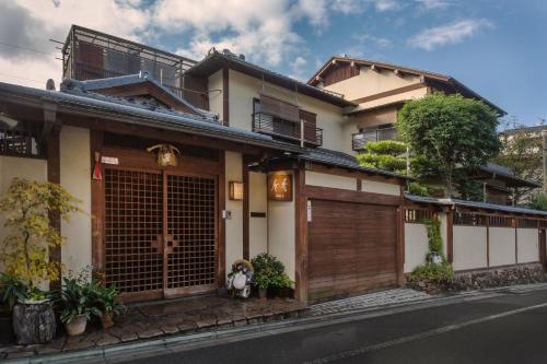 a house on the side of the street at Kamuroan in Kyoto