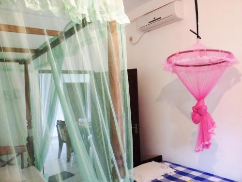 Postel nebo postele na pokoji v ubytování Rainbow Guest House