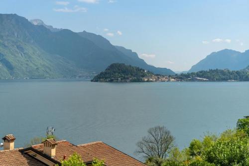 a view of a large body of water with mountains at Balcone di Noa e Stella in Menaggio
