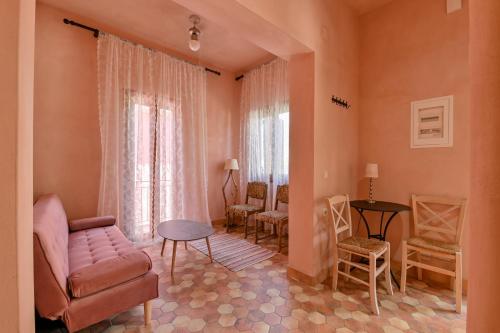 a living room with a couch and a table at Citron, Parga Center Residence in Parga