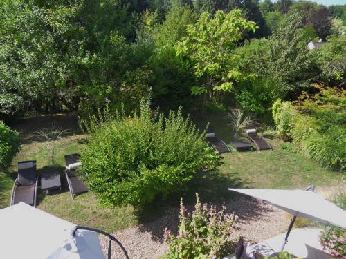 an overhead view of a garden with chairs and trees at Troglodelice in Azay-le-Rideau