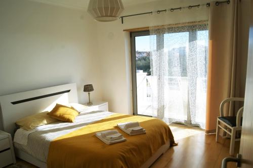 Ένα ή περισσότερα κρεβάτια σε δωμάτιο στο Casa da Vigia Ericeira