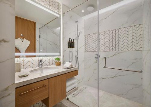 a bathroom with a shower and a sink at Hyatt Place Bhopal in Bhopal