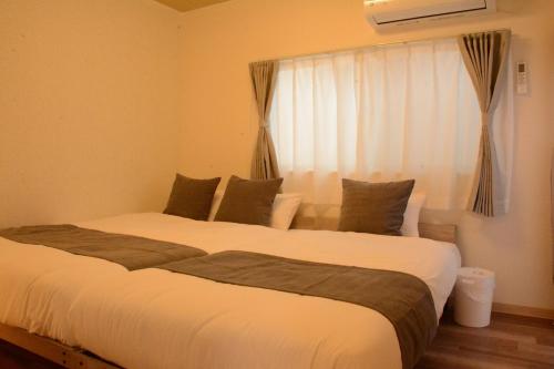 桃谷1丁目テラスハウスWalking distance to Osaka Korean Town Accommodates up to 10 guests