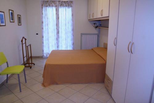 Ένα ή περισσότερα κρεβάτια σε δωμάτιο στο Casavacanze Internazionale