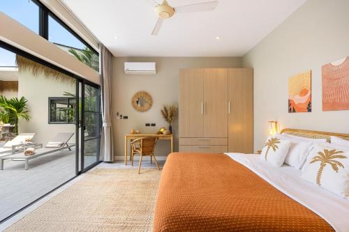 a bedroom with an orange bed and a desk at VILLA LOUMA - 4 Bedrooms with Private Pool in Koh Samui