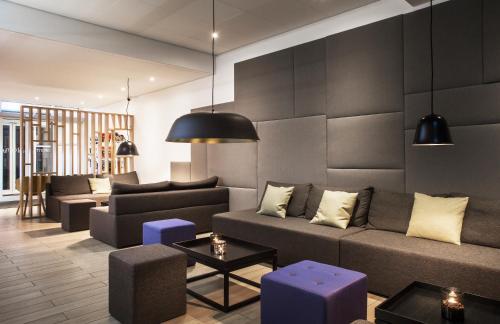 a living room with a couch and a table at Storm Hotel by Keahotels in Reykjavík