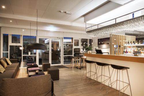 a lobby with a bar and a restaurant at Storm Hotel by Keahotels in Reykjavík