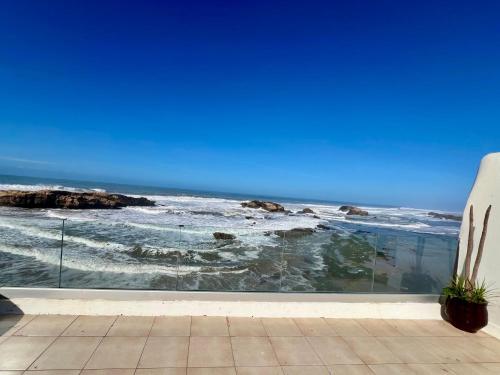 a view of the ocean from a balcony at Riad d'exception vue mer au coeur de la médina Essaouira - Mandji Dream in Essaouira