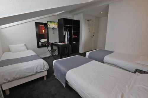 Ένα ή περισσότερα κρεβάτια σε δωμάτιο στο Hôtel Alizé