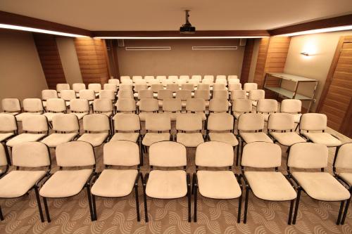an empty room with rows of chairs in it at Grand Hotel Gaziantep in Gaziantep