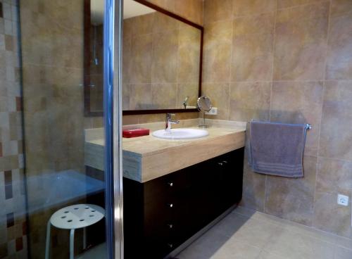 a bathroom with a sink and a shower at Casa Jazmin in Cala Bona