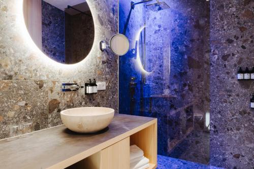 a bathroom with a sink and a shower at Torghele's Wald & Fluh in Balderschwang