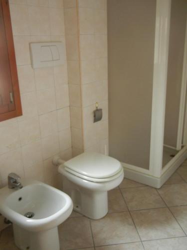 a bathroom with a toilet and a sink at casa vacanza Cicogna in San Lazzaro di Savena
